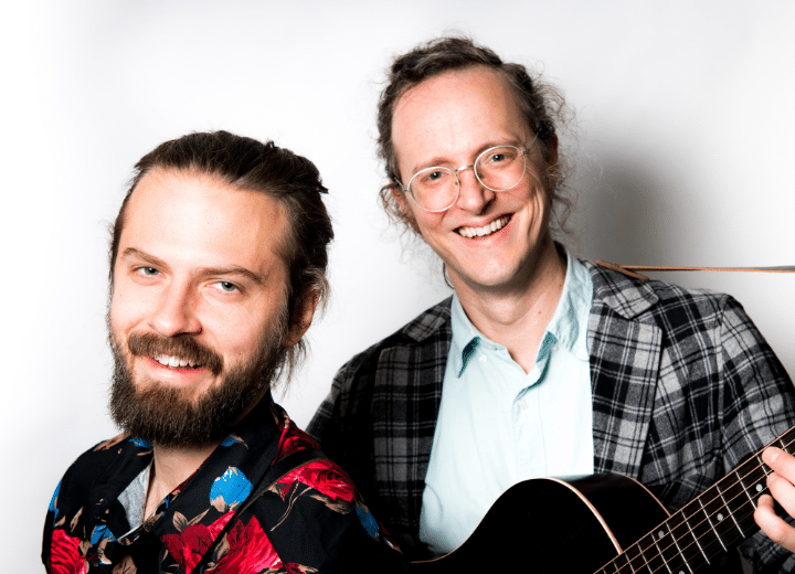 Jacob Joliff and Michael Daves photo, smiling toward the camer